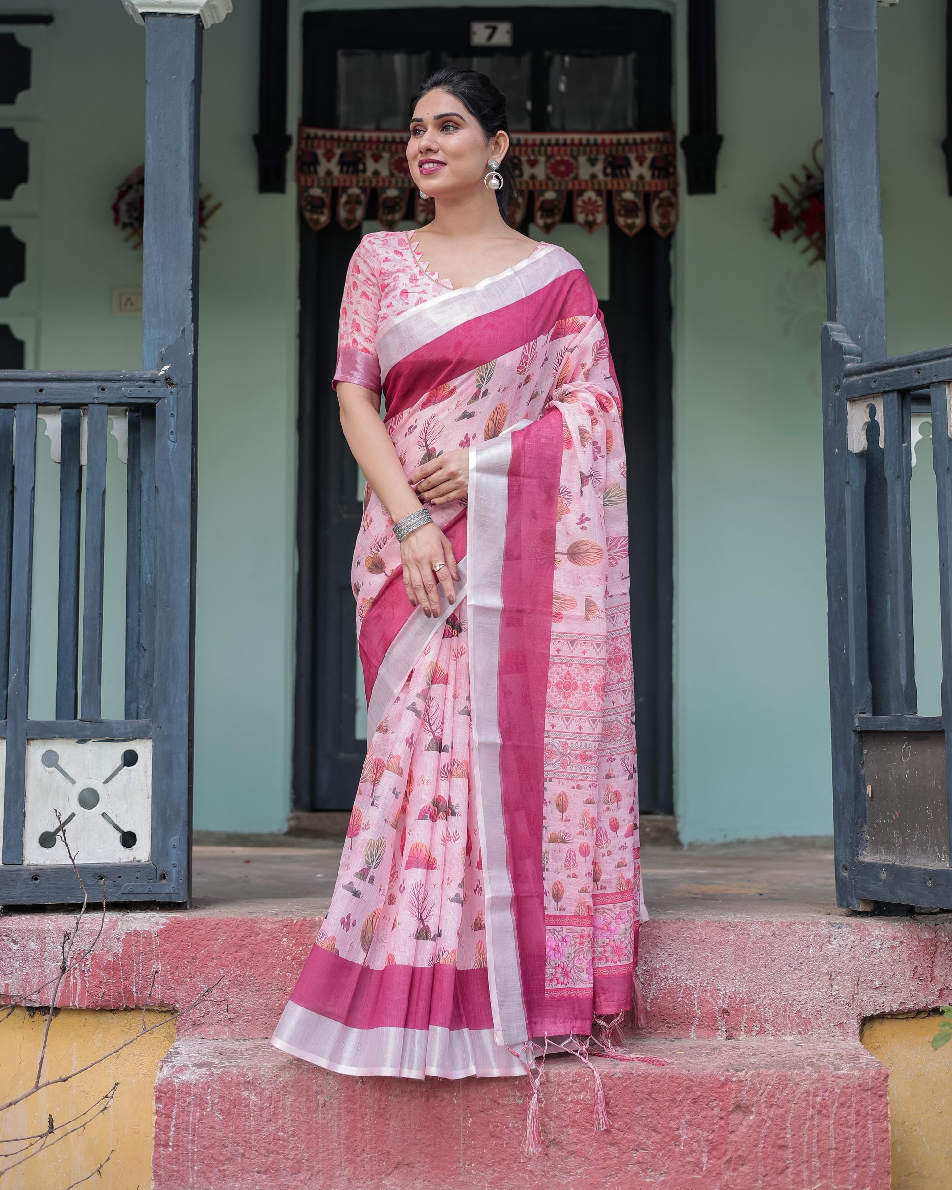 Soft Pink Linen Floral Printed Saree with Contrast Border and Tassel Detailing with Unstitched Blouse for Women