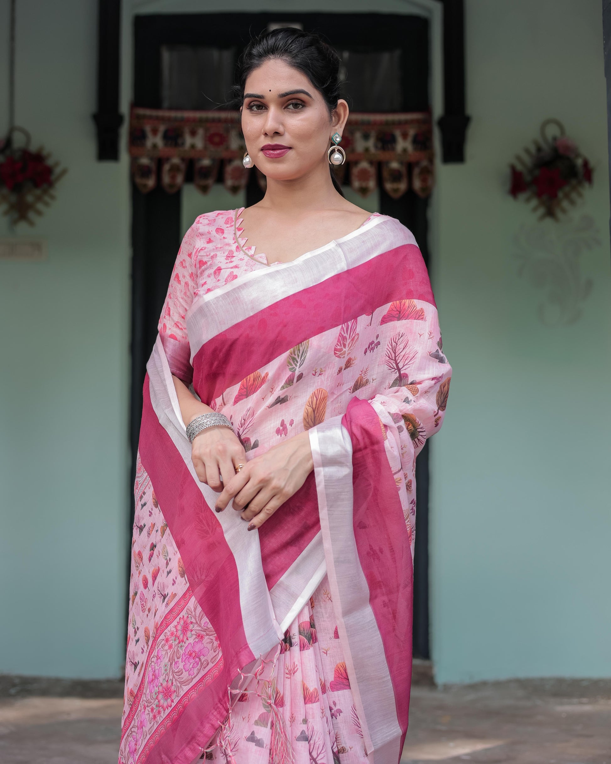 Soft Pink Linen Floral Printed Saree with Contrast Border and Tassel Detailing with Unstitched Blouse for Women