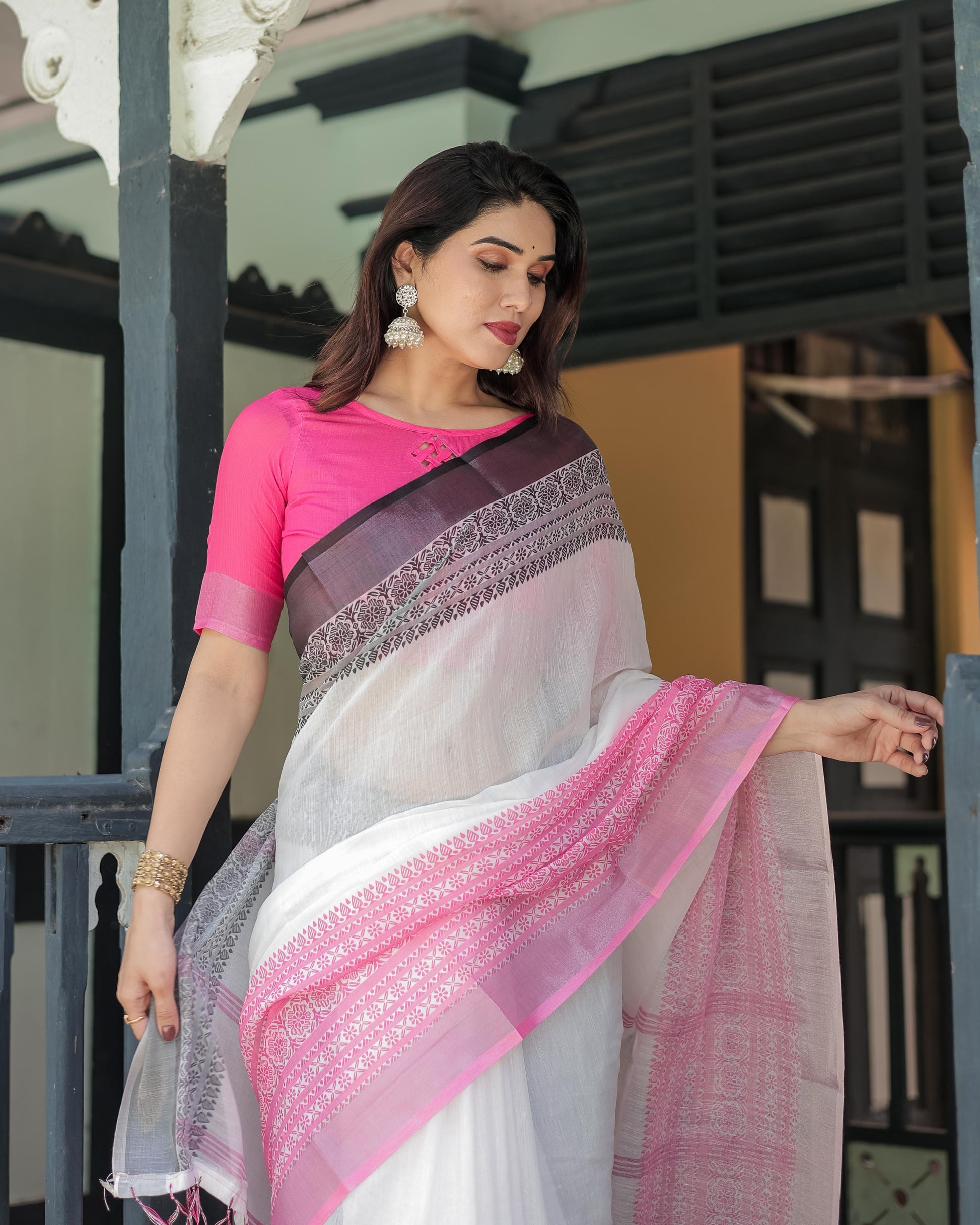 White and Pink Linen Printed Saree with Contrast Border Design and Tassel Detailing with Unstitched Blouse for Women