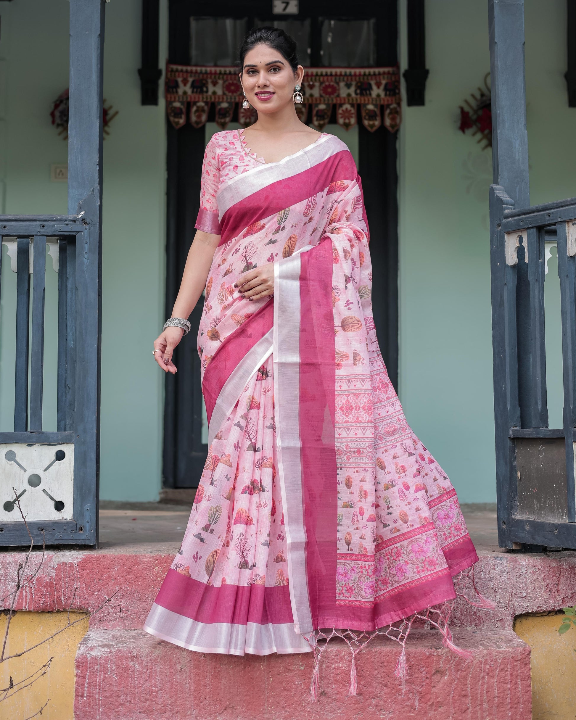 Soft Pink Linen Floral Printed Saree with Contrast Border and Tassel Detailing with Unstitched Blouse for Women