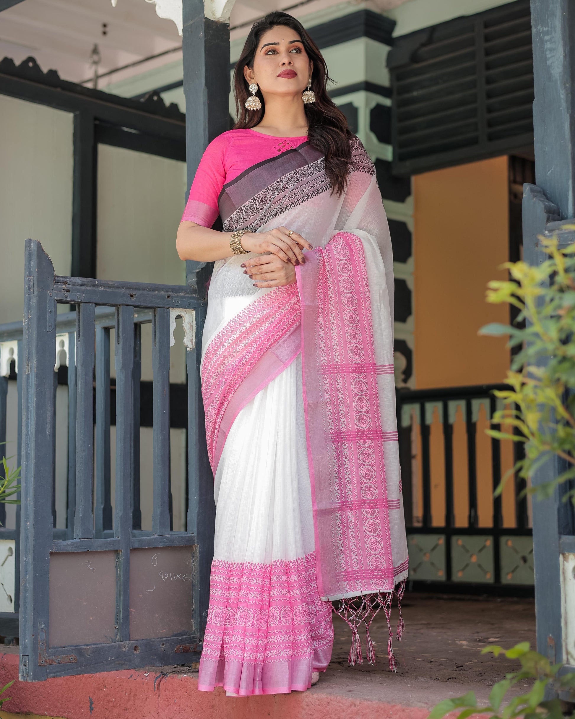White and Pink Linen Printed Saree with Contrast Border Design and Tassel Detailing with Unstitched Blouse for Women