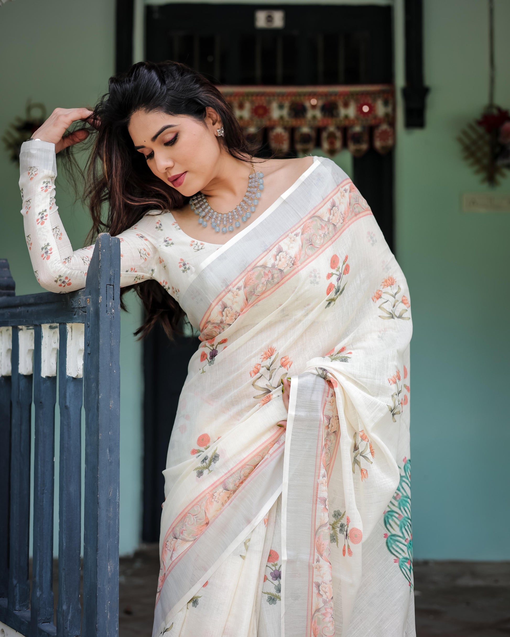 Ivory Pure Cotton Linen Saree with Pastel Floral Design And Tassel Detailing With Unstitched Blouse