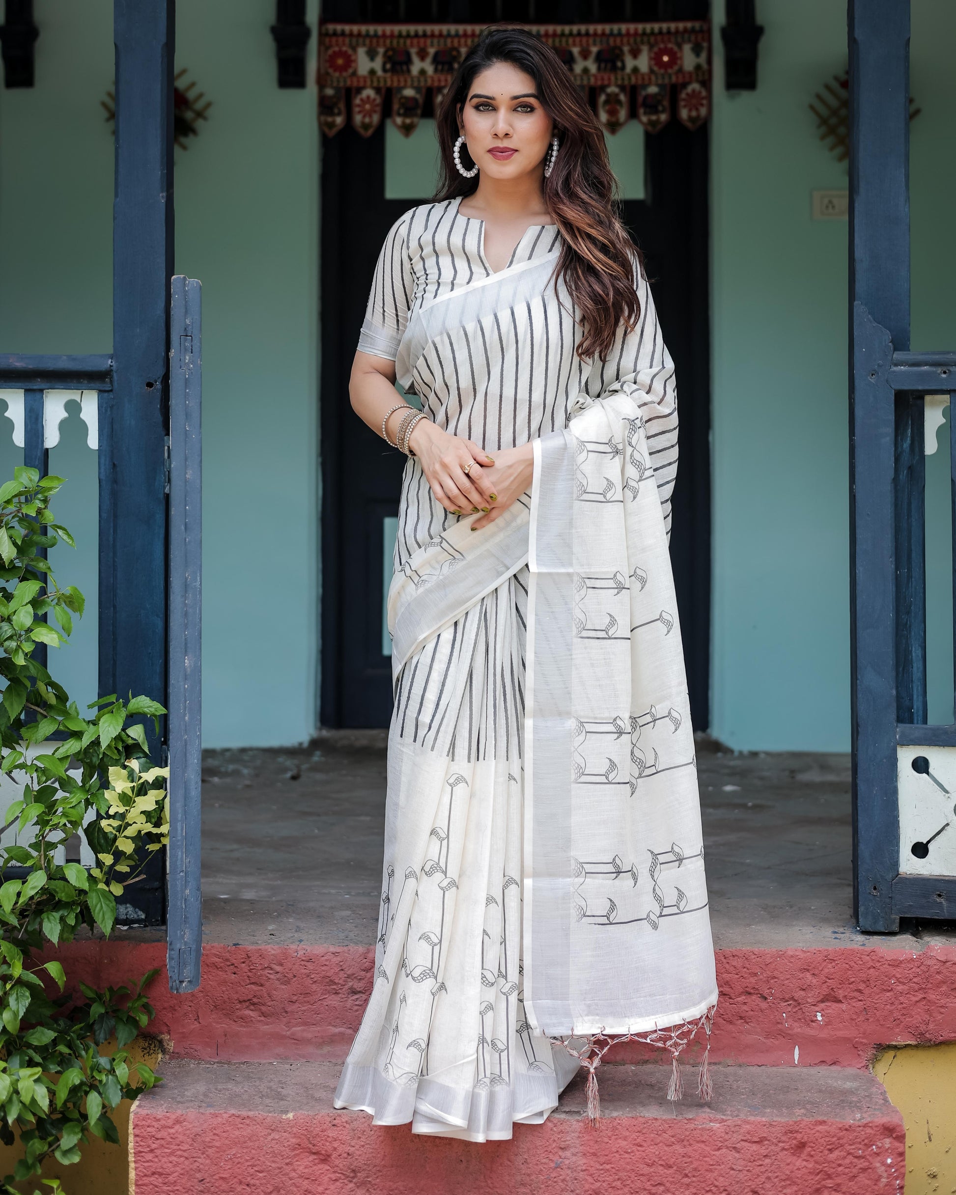White and Black Pure Cotton Linen Saree with Striped Pattern And Tassel Detailing With Unstitched Blouse