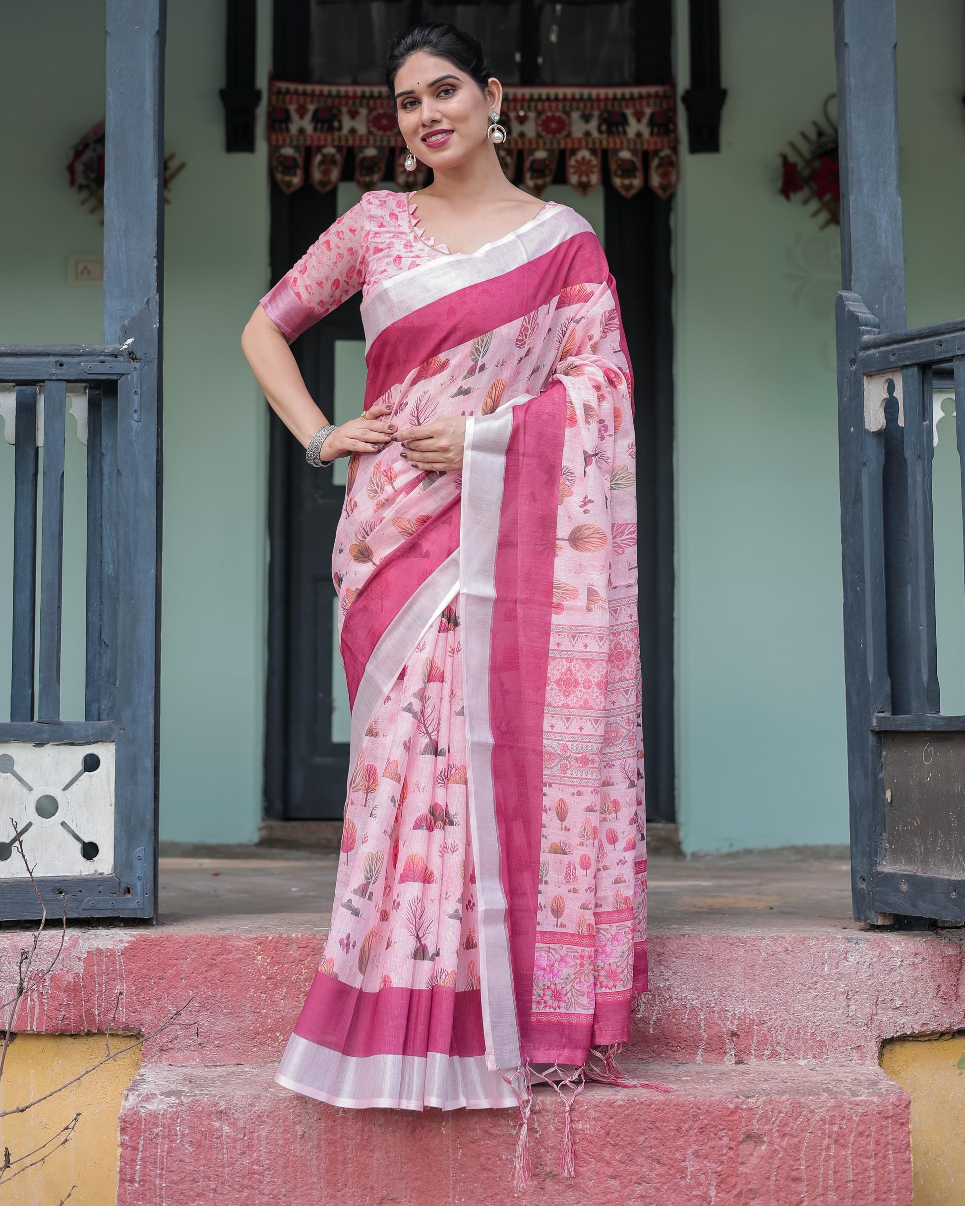 Soft Pink Linen Floral Printed Saree with Contrast Border and Tassel Detailing with Unstitched Blouse for Women
