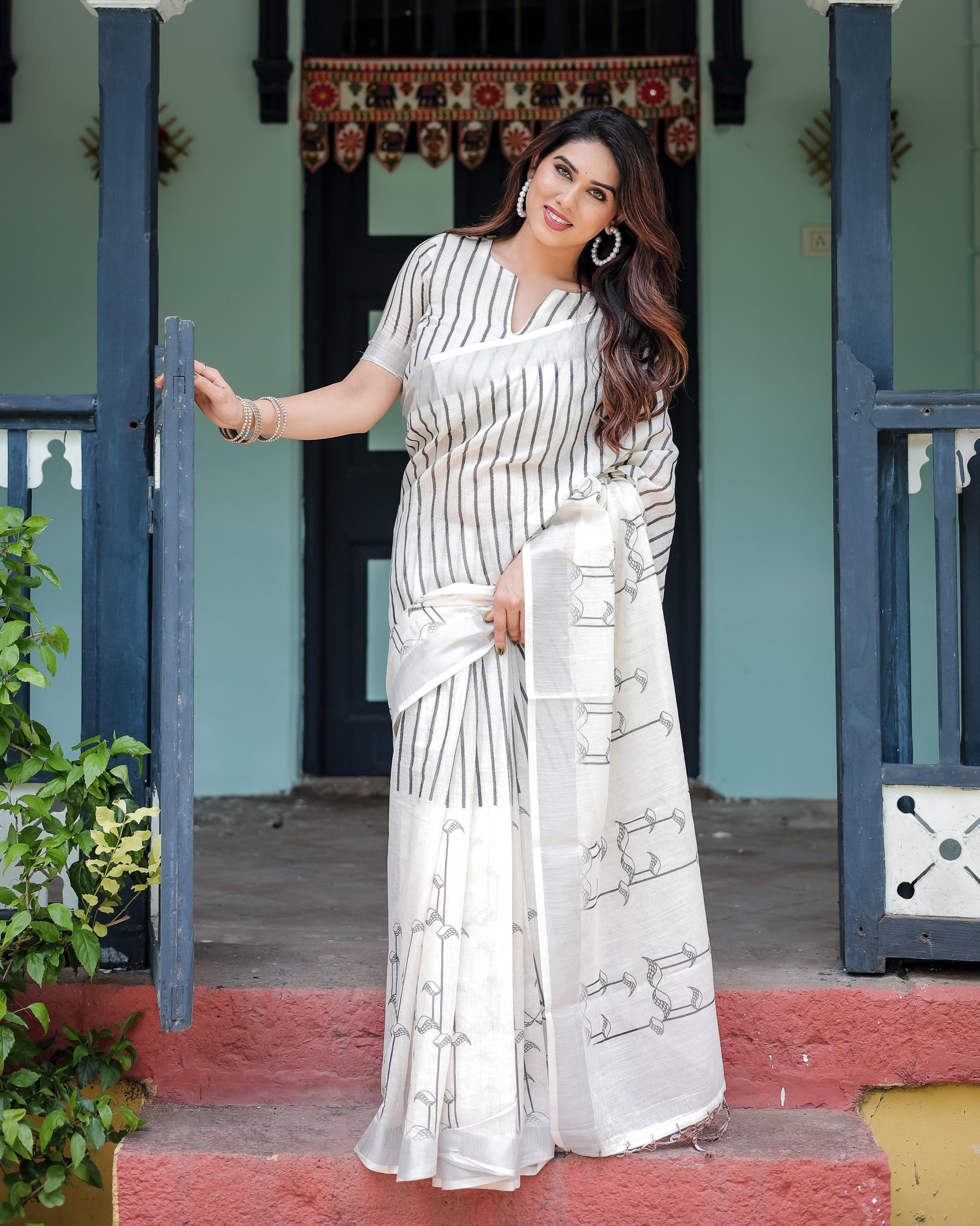 White and Black Pure Cotton Linen Saree with Striped Pattern And Tassel Detailing With Unstitched Blouse