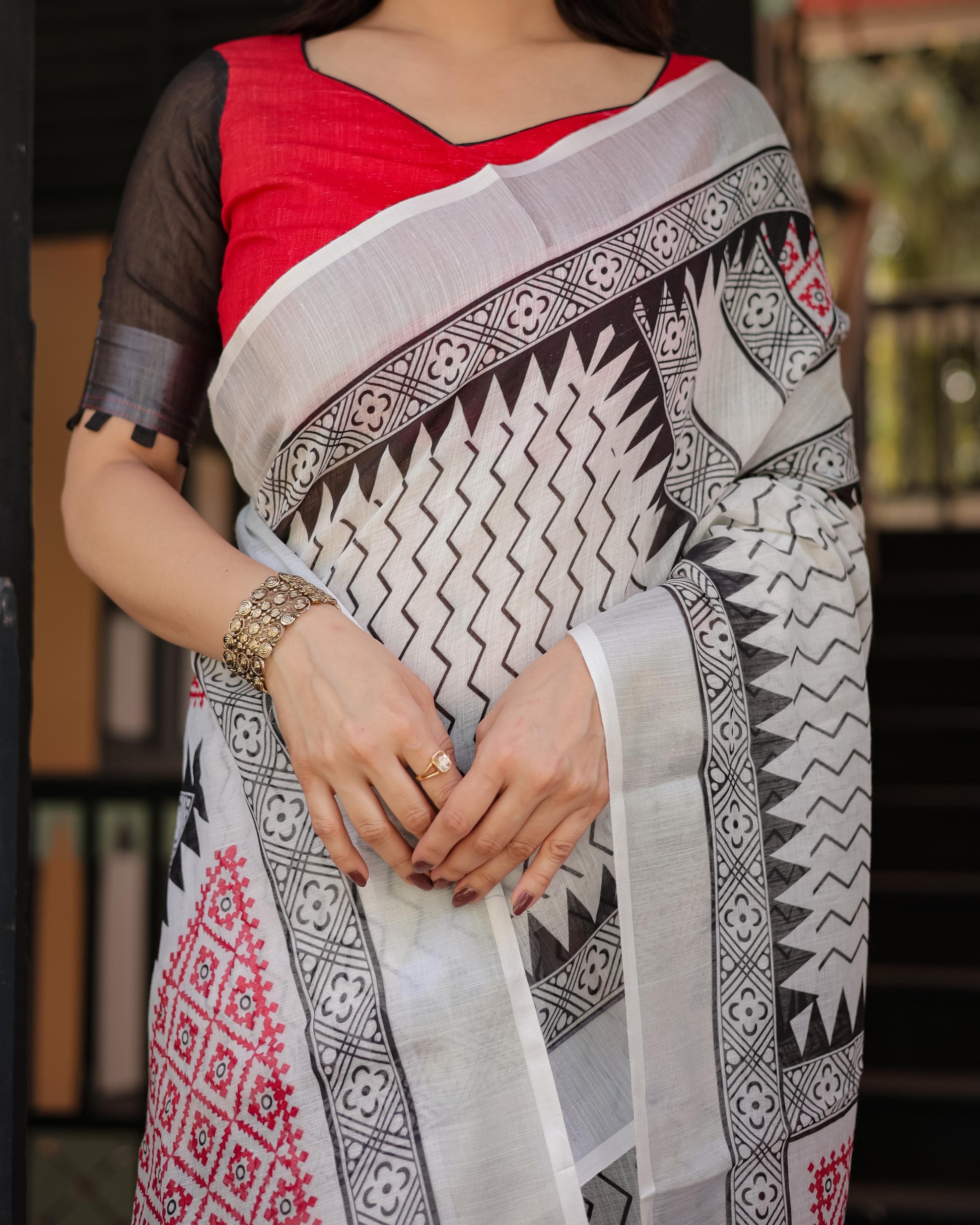 Black and White Geometric Pattern Pure Cotton Linen Saree with Red Accents And Tassel Details With Unstitched Blouse