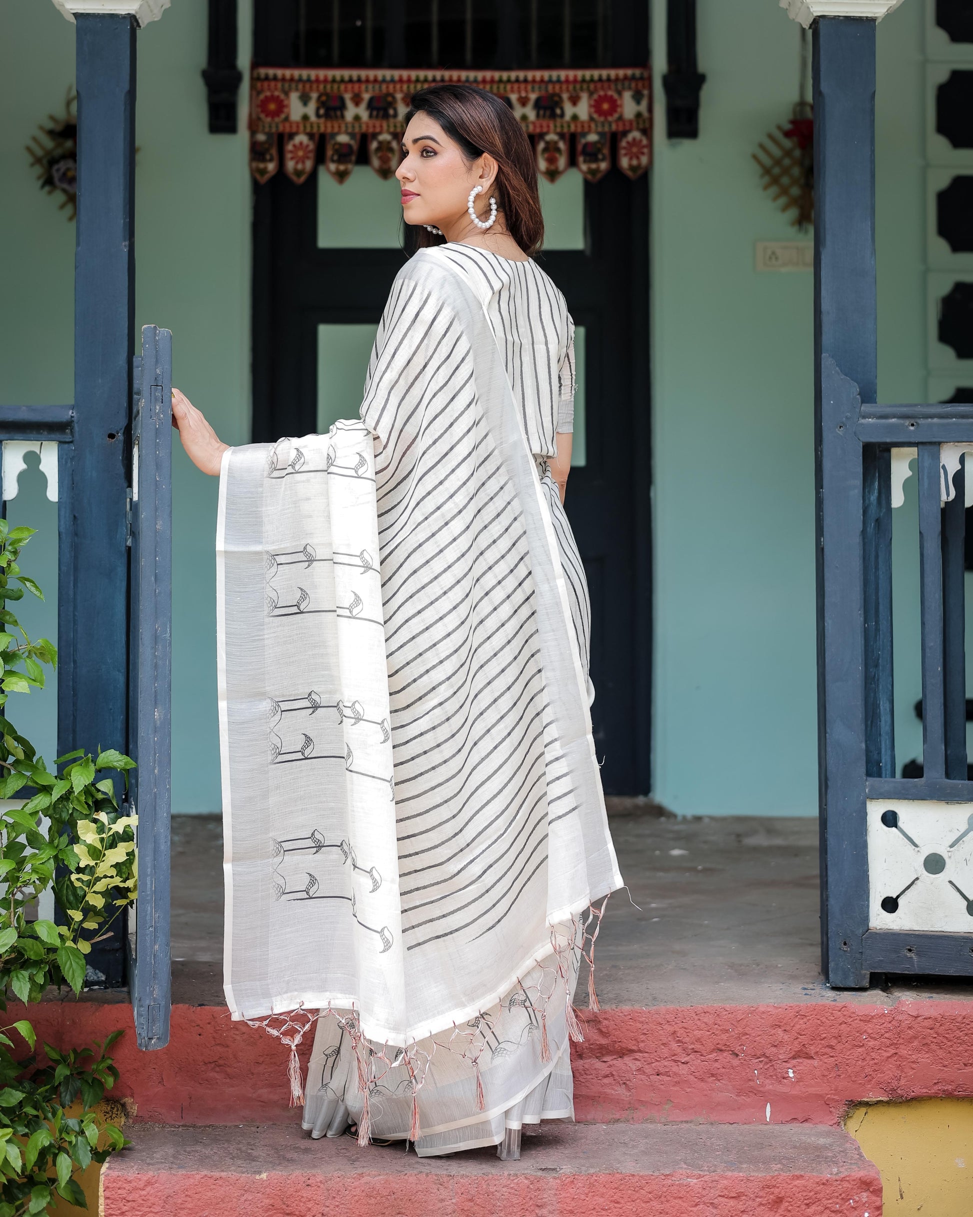 White and Black Pure Cotton Linen Saree with Striped Pattern And Tassel Detailing With Unstitched Blouse