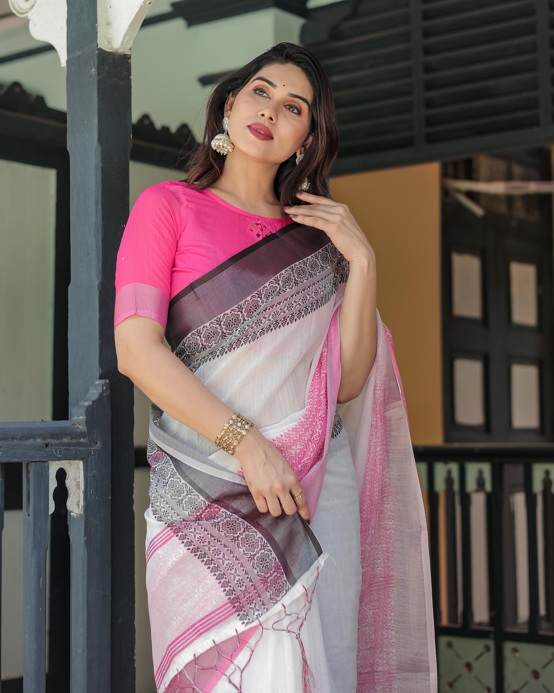 White and Pink Linen Printed Saree with Contrast Border Design and Tassel Detailing with Unstitched Blouse for Women