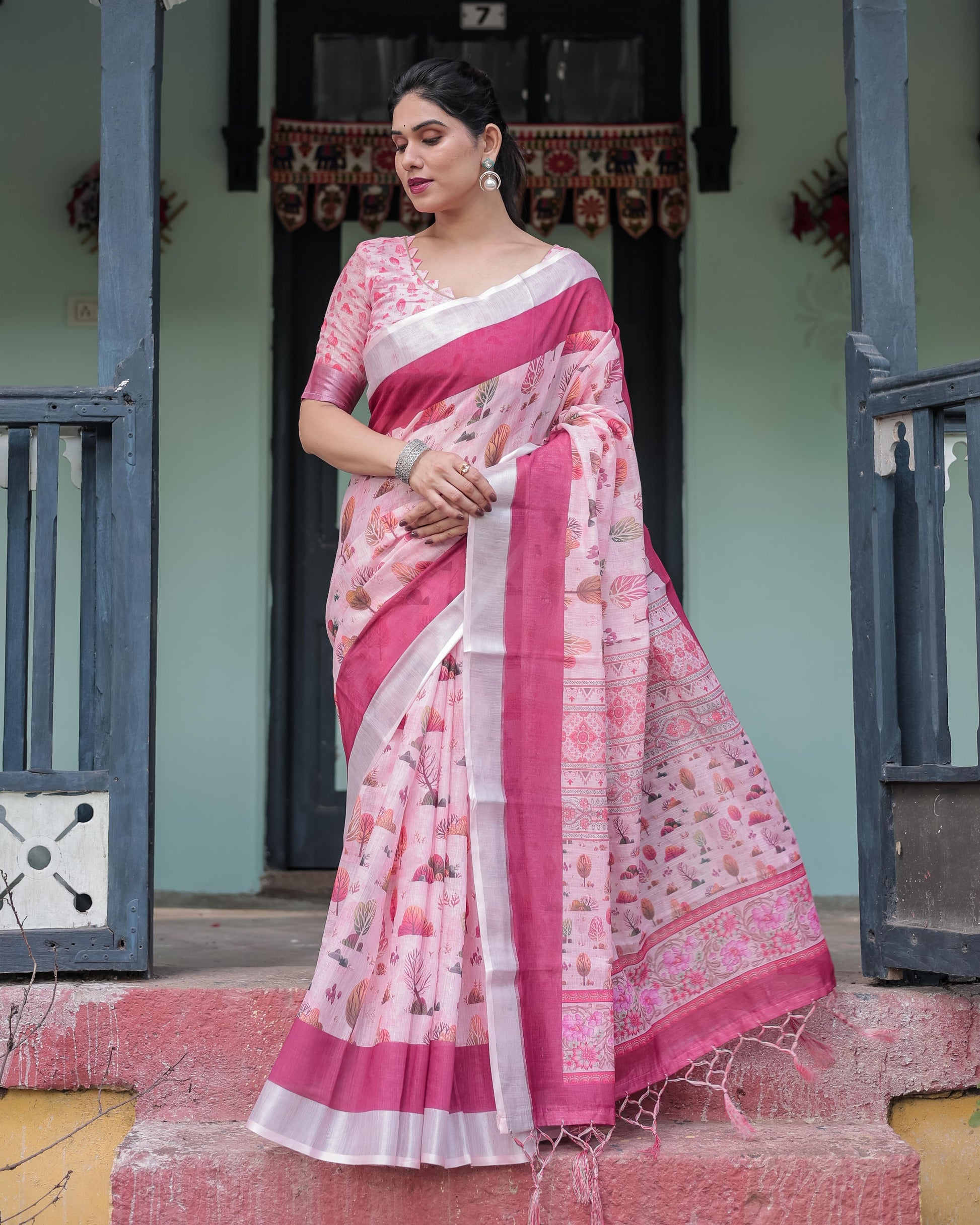 Soft Pink Linen Floral Printed Saree with Contrast Border and Tassel Detailing with Unstitched Blouse for Women