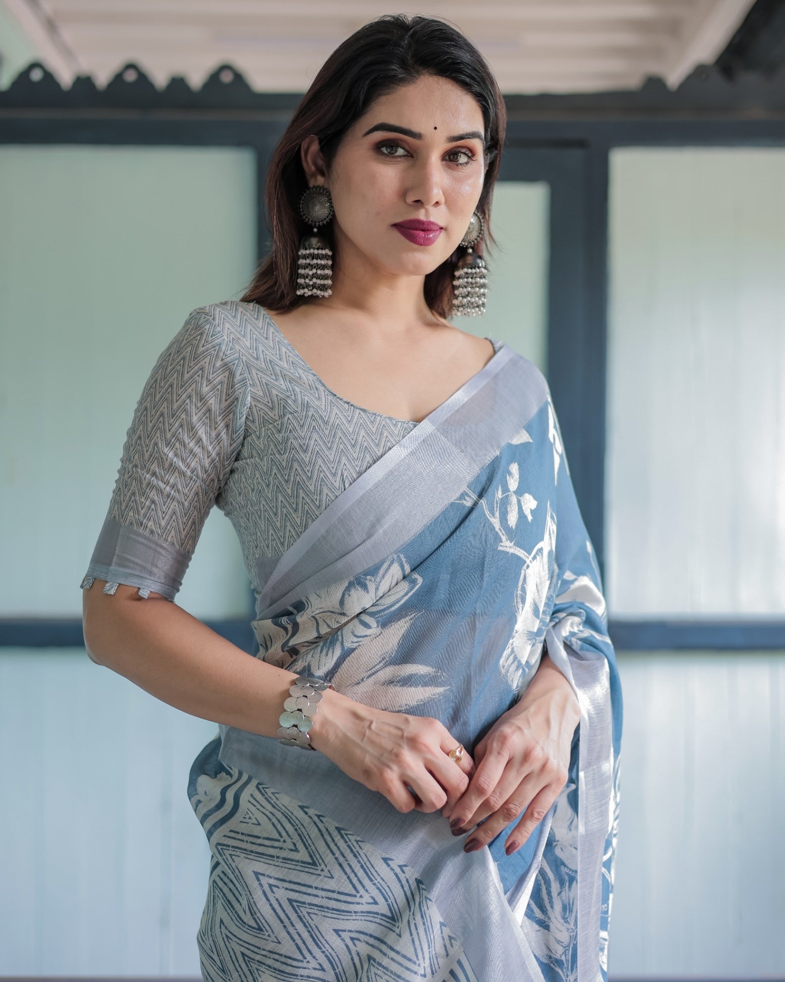 Pastel Blue Floral and Geometric Printed Cotton Linen Saree and Tassel Edges With Unstitched Blouse