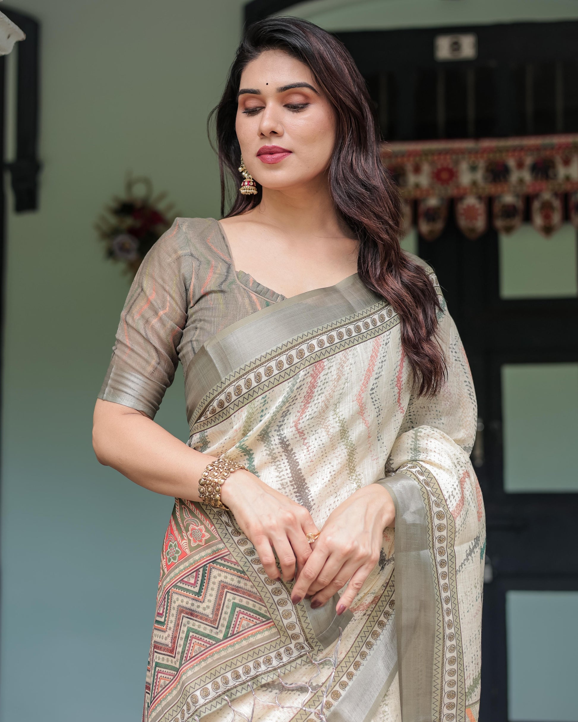 Cream and Olive Green Linen Printed Saree with Ethnic Pattern Border and Tassel Detailing with Unstitched Blouse for Women