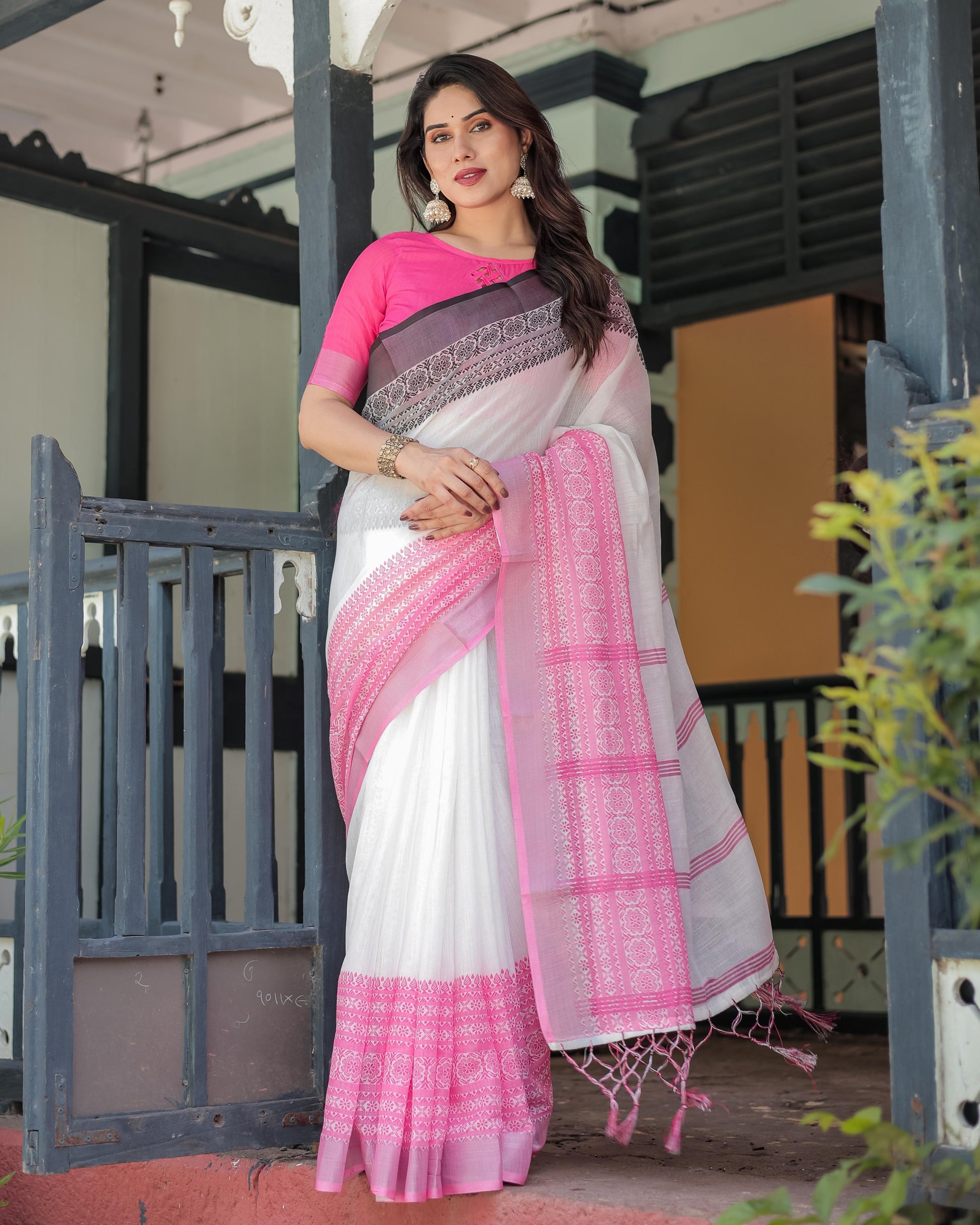 White and Pink Linen Printed Saree with Contrast Border Design and Tassel Detailing with Unstitched Blouse for Women
