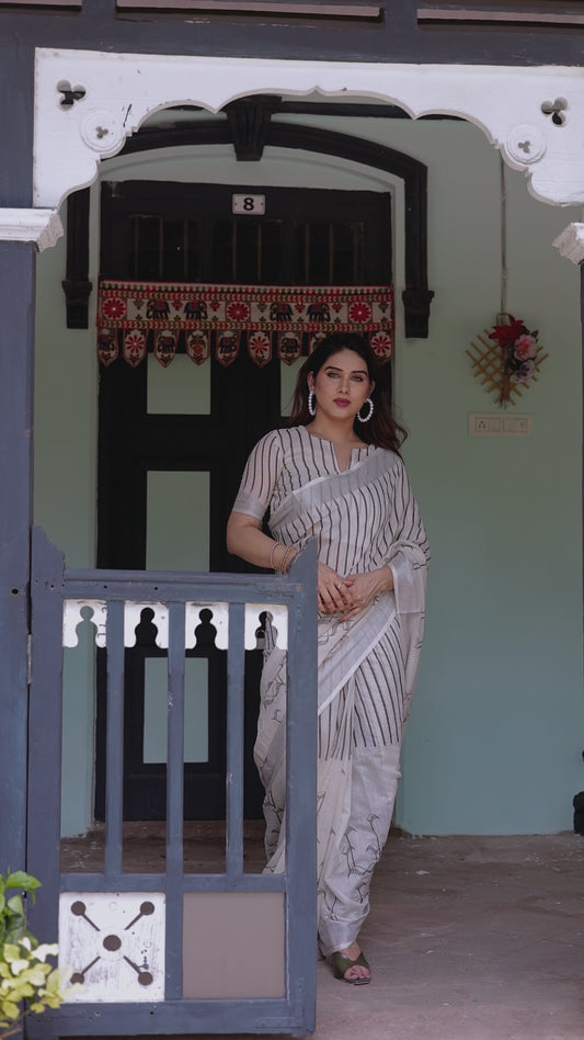 White and Black Pure Cotton Linen Saree with Striped Pattern And Tassel Detailing With Unstitched Blouse