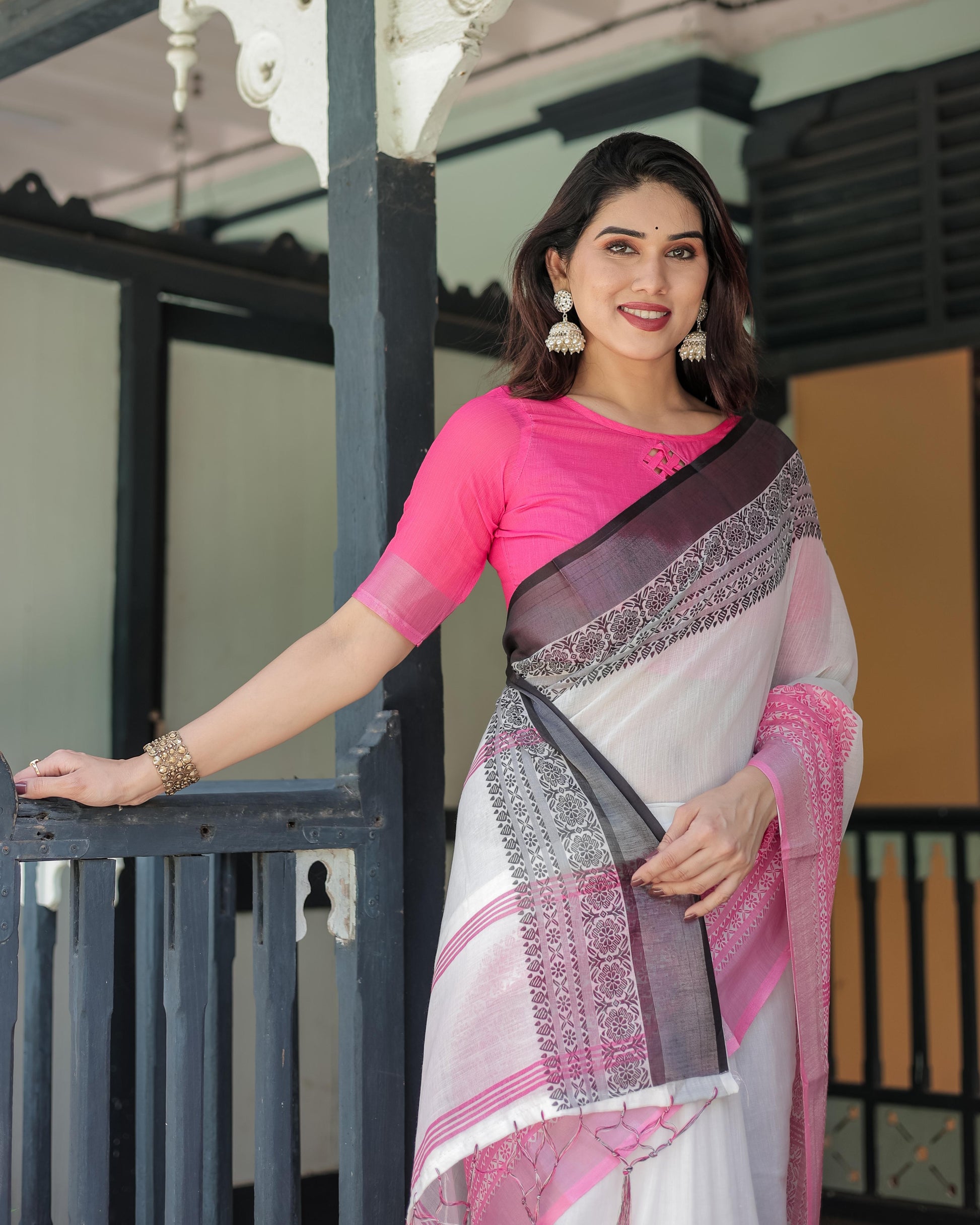 White and Pink Linen Printed Saree with Contrast Border Design and Tassel Detailing with Unstitched Blouse for Women