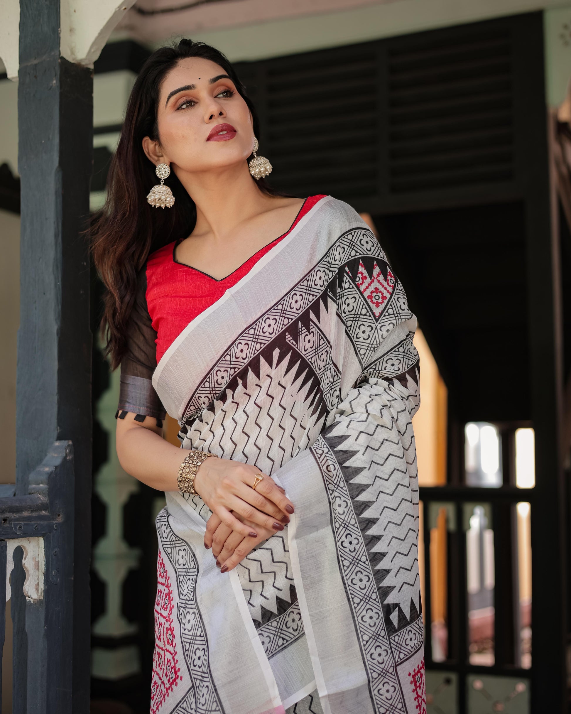 Black and White Geometric Pattern Pure Cotton Linen Saree with Red Accents And Tassel Details With Unstitched Blouse